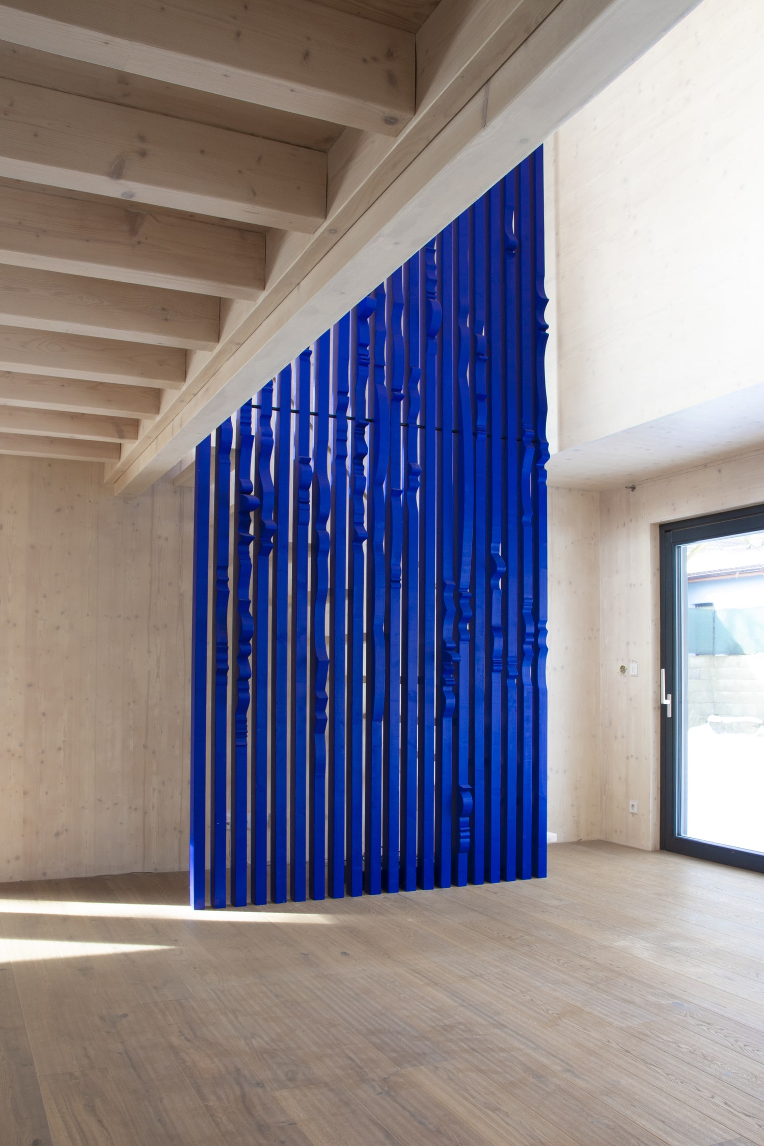 Ultramarine Staircase Wall for Private Residence in Milovice Made out of Solid Wood