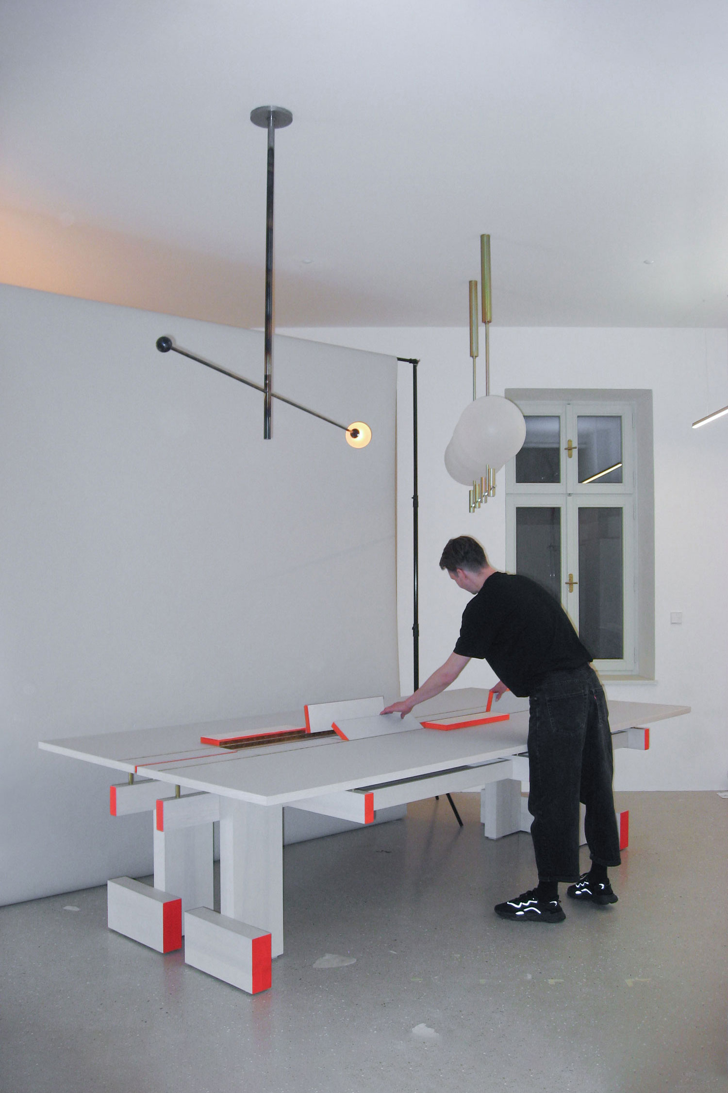 Luna-Orbit-swivel-luminaire-on-top-of-table-made-of-steel-designed-by-Jiri-Krejcirik-environment